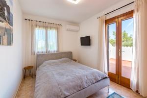 Postel nebo postele na pokoji v ubytování Ferienhaus Casa Kristel + 37 fotografií