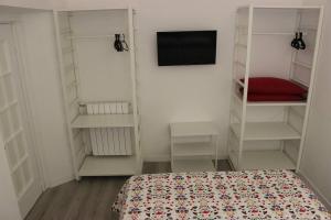 Colosseo Living Suites客房内的一张或多张床位