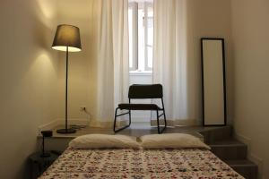 Colosseo Living Suites客房内的一张或多张床位