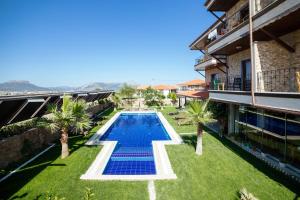 an image of a swimming pool in a house at Kuzey Park Hotel in Gokceada Town