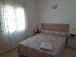 Posteľ alebo postele v izbe v ubytovaní Apartamentos Vista