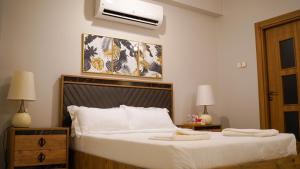 Voodi või voodid majutusasutuse AECO lovely 2 bedroom apartment for family and friends toas