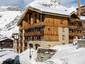 a ski lodge in the mountains with snow at Appartement haut de gamme avec Wifi, parking et balcon, au pied des pistes à Val-d'Isère - FR-1-694-151 in Val dʼIsère