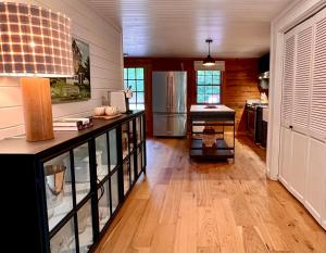 a kitchen with a counter and a refrigerator at Glass Cabin in Eureka Springs
