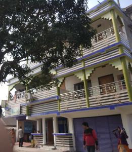 a man standing in front of a building at Babusona Homestay in Jaldapara in Mādāri Hāt