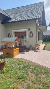 a house with a patio with a gazebo at U Gosi Zator in Zator