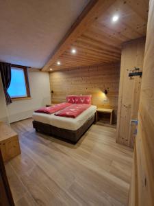 a bedroom with a bed in a wooden room at Oga Sweet Home in Oga
