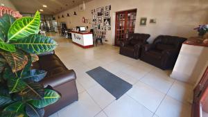 an overhead view of a living room with leather furniture at Hotel Pueblo Huarpe in San Luis
