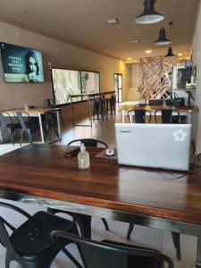 an office with a table with a laptop on it at Hotel Pueblo Huarpe in San Luis +40 photos