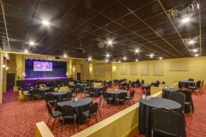 a banquet hall with tables and chairs and a stage at Keestone Studio with Resort Amenities! in Loretto +20 photos