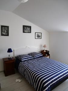 Llit o llits en una habitació de La Maison Verte 71 m²