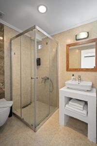 a bathroom with a shower and a sink at Costa Viva Bodrum in Bodrum City