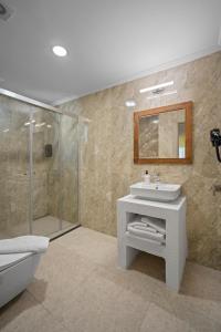 a bathroom with a toilet and a sink and a shower at Costa Viva Bodrum in Bodrum City