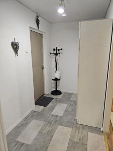 an empty room with a cross on the wall at Apartment on Constantin Negruzzi in Chişinău