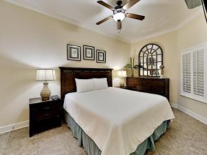 a bedroom with a bed and a ceiling fan at Phoenix West II #2109 in Orange Beach +30 photos