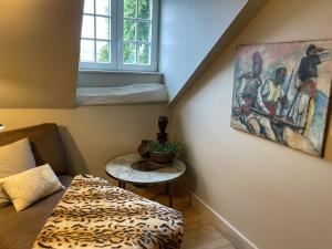 Postel nebo postele na pokoji v ubytování L'Art de la fugue