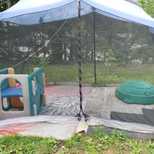 a playground with a tent and a play set at Le Chalet Amical in Saint-Paulin +16 photos