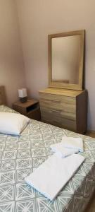 En eller flere senge i et værelse på Heaven House