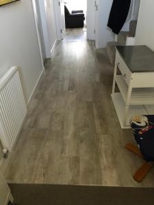 a hallway with a wooden floor in a house at large en suite bedroom with one double bed No breakfast provided in Edinburgh