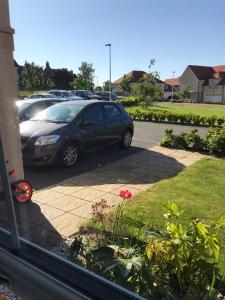 a car parked in a parking lot at large en suite bedroom with one double bed No breakfast provided in Edinburgh