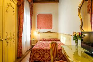 Postel nebo postele na pokoji v ubytování Hotel Al Vagon