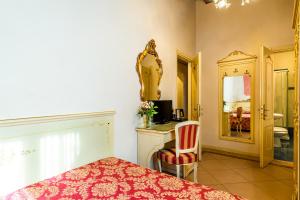 Postel nebo postele na pokoji v ubytování Hotel Al Vagon