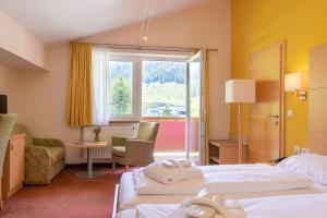 Posteľ alebo postele v izbe v ubytovaní Hotel Sportalmmm, Hoch-Genuss