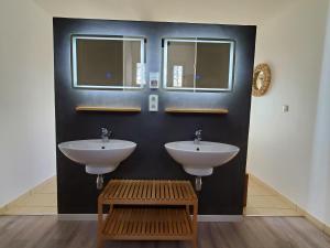 a bathroom with two sinks and a bench and two windows at LA FONTAINE AU LOUP in Saint-Maurice-sur-Eygues +56 photos