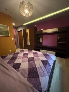 Llit o llits en una habitació de Benvenuti Apartments