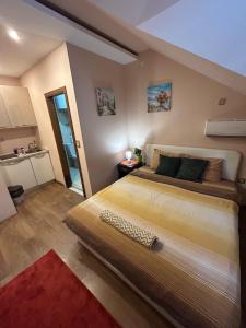 Llit o llits en una habitació de Benvenuti Apartments