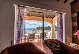 a living room with a view of the ocean at Villa Oceano by Indigo in Carvoeiro