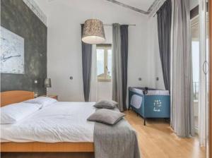 a bedroom with a large bed and a large window at Villa Tomko in Brovinje +10 photos