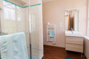 a bathroom with a glass shower and a sink at Auberge du Manoir d'Archelles in Arques-la-Bataille +59 photos