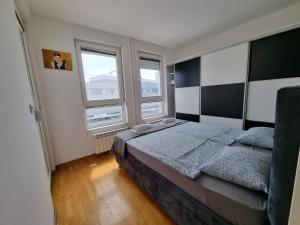 Postel nebo postele na pokoji v ubytování Euforia apartment