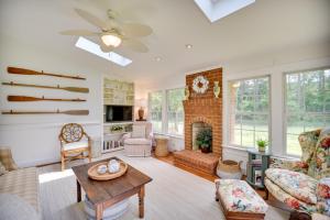 a living room filled with furniture and a fireplace at Mobjack Bay Rental on Private Cove! in Onemo