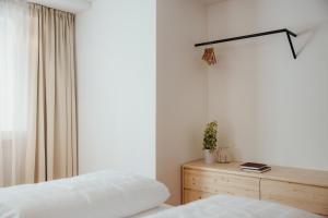 Postel nebo postele na pokoji v ubytování La Residence