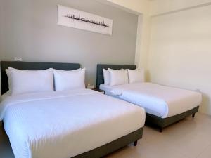 Llit o llits en una habitació de Happy Fat B&B 寵物友善