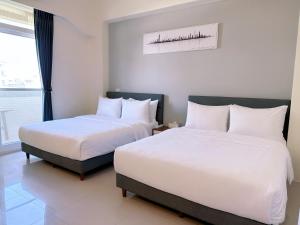 Llit o llits en una habitació de Happy Fat B&B 寵物友善