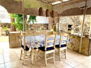 a table and chairs in a kitchen with a table and a table at Casa Delfin in Corralejo