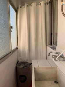 a bathroom with a sink and a shower curtain at Sagunto in Sagunto