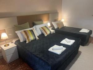 Кровать или кровати в номере IN ROMA LIFE