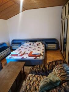 a room with a bed and a table in it at IS Guest House in Ohrid