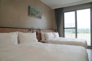Postel nebo postele na pokoji v ubytování inami B&B
