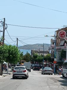 a busy city street with cars on the road at Marinela Apartment in Sarandë