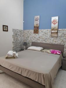 Ένα ή περισσότερα κρεβάτια σε δωμάτιο στο casa G&G