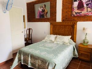 Voodi või voodid majutusasutuse Hotel Boutique Casona Mashei toas