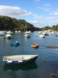 a group of boats in a body of water at Villa Mer, Campagne et départ de randonnées in Moëlan-sur-Mer