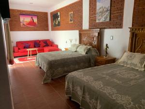 Voodi või voodid majutusasutuse Hotel Boutique Casona Mashei toas