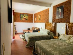 Voodi või voodid majutusasutuse Hotel Boutique Casona Mashei toas