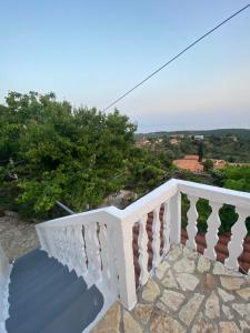 a view from the balcony of a house at Vintage Mediterranean house in Himare